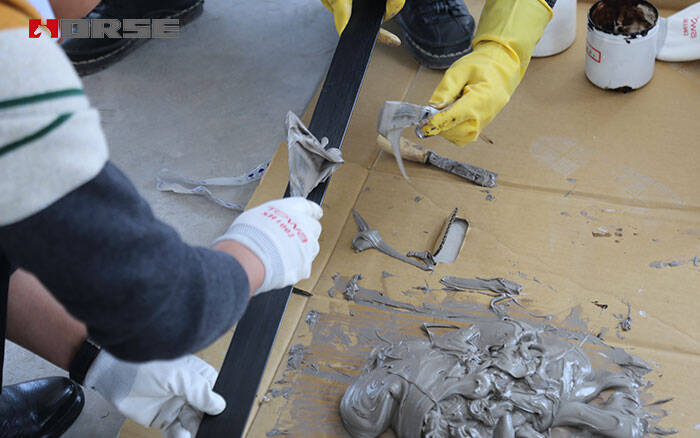 applying carbon fiber laminate adhesive applying carbon fiber laminate adhesive