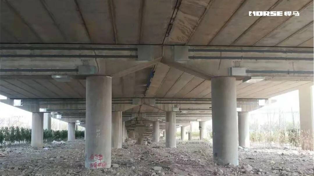 Prestressed CFRP Laminate Reinforcement System for Bridge Prestressed CFRP Laminate Reinforcement System for Bridge